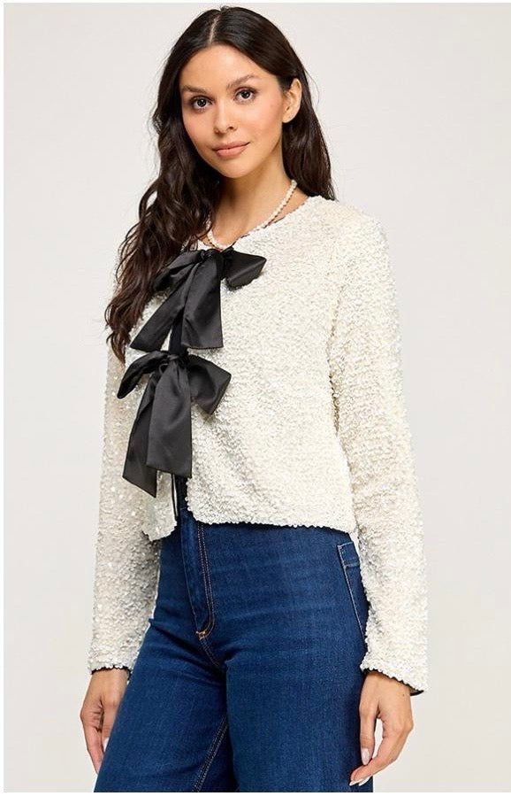 Saco lentejuelas con moño